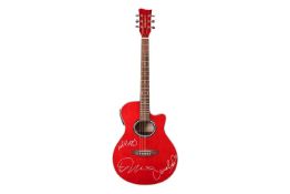 A modern Legacy electro-acoustic guitar, signed by Ed Sheeran and Camila Cabello, the duo having col