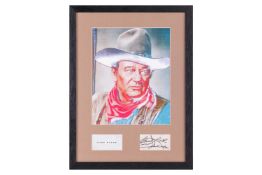 John Wayne: a framed and glazed photograph with inset signature card, reading 'Good Luck, John Wayne