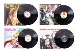 Four signed 1980s vinyl records, comprising Adam and the Ants, 'Stand & Deliver' 12