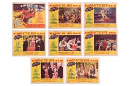 Gene Kelly: an original 'Singin' In The Rain' 1952 lobby card set (x8), from the film featuring Gene
