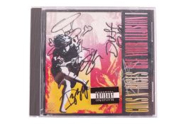 Guns N' Roses: a band-signed 'Use Your Illusion' CD, the cover with the signatures of Axl Rose, Slas