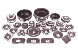 A large collection of Wedgwood black and white basalt ware, 20th century, to include a pedestal bowl