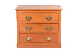 An Edwardian pine chest of three long drawers, raised on a plinth base, measuring 91 cm x 79 cm x 46