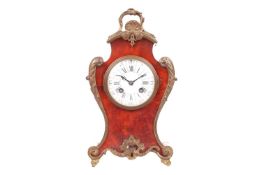A Louis XV-style red Boulle balloon form 8-day bracket clock with applied gilt metal mounts, fitted 