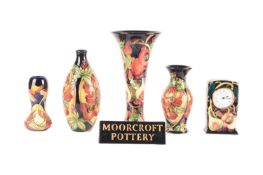 A Moorcroft collection of six pieces consisting of an Amberslade pattern baluster vase, impressed an