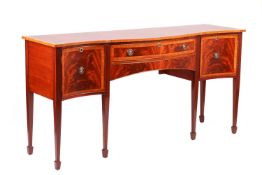A craftsman-made George III style mahogany sideboard, 20th century, with broad crossbanded and ebony
