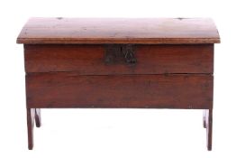 An early 18th-century six-plank oak coffer, with staple hinges and locking plate, measuring 81 cm x 