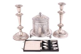 A Victorian EPNS cylindrical wafer box, together with a pair of candle-stick holders and a set of si