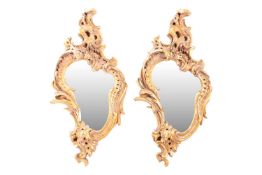 A pair of Rococo-style gilt plaster composition cartouch wall mirrors, 20th century, 42 cm wide x 90
