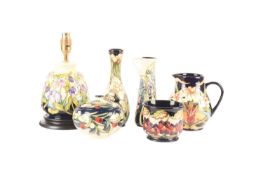 A collection of Moorcroft pieces comprising a table lamp in the pattern Step into Spring, a tapering