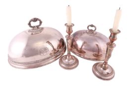 A pair of Sheffield-plated table candle sticks each bearing a blazing sun stamp, 29 cm overall heigh
