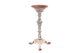 A Coalbrookdale-style cast iron pedestal bird bath with established weathered surface, the circular 