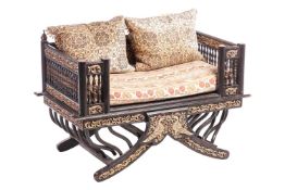 A Burmese black lacquered Howdah chair, 20th century with gallery back and carved and parcel gilt de