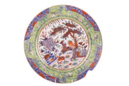 A Chinese circular blue and white charger, early Qing Dynasty, early 18th century, painted with a sc