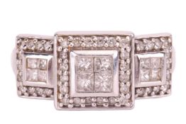 A diamond-set ring, with bezel-set princess-cut diamonds, surrounded by round brilliant diamonds, in