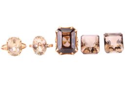 Three gem-set rings comprising an oval citrine ring in a yellow metal mount marked '9ct', size M1/2,