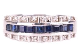 A sapphire and diamond half hoop ring in 18ct white gold, centred with a row of table-cut sapphires 