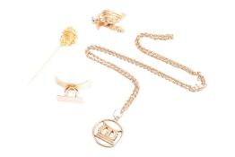 A small collection of Ashanti jewellery; to include a nugget stick pin testing as high carat, a gold