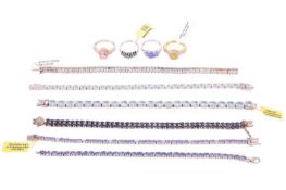 A collection of jewellery items including a tanzanite-set ring in a 14ct white gold mount, size P1/2