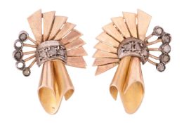 A pair of diamond set scroll earrings, circa 1940s, in a scrolling spray design set with diamond chi