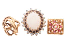 Three rings to include an opal and garnet cocktail ring in 9ct yellow gold, size O, a seed pearl and
