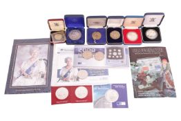 A collection of silver-based coins and proofs including a 1973 50 pence coin, a 1999 total solar ecl