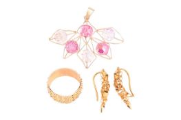 A pair of drop earrings, a dress ring and a pendant with plastic beads; the openwork earrings with a