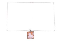 A shell cameo pendant on a chain with a diamond-set clasp, the square shell cameo depicting a smiley