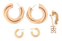 A pair of 9 carat gold triple row hoop earrings, the hollow hoops with post fittings. 4cm diam. 11.3