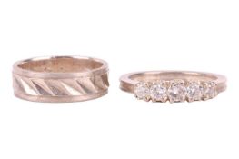 A diamond-set half hoop ring with a wedding band; the half hoop ring set with five graduated brillia