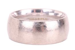An 18ct white gold wedding band, the 8mm court-shaped band engraved to the interior with 'AN8', Shef