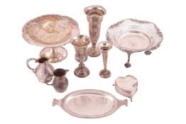 A group of silver comprising a silver bon bon dish with pierced decoration raised on three double sc