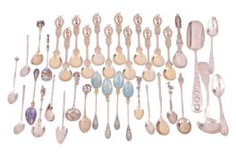 A mixed quantity of teaspoons and souvenir spoons, comprising twelve gilt souvenir spoons featuring 
