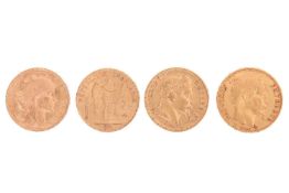 Four 20 franc coins;to include an 1859 Napoleon III coin with plain head to the right;an 1864 Napole