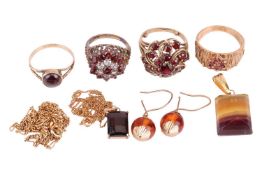 A small collection of jewellery items including a garnet-set floral bombé-style ring, size M with si
