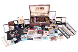A large group lot of costume and silver jewellery, including multiple gem-set rings, a silver bangle