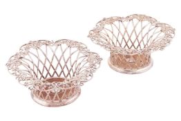A pair of Victorian silver-plated wine coasters by Elkington and Co., 1853, of woven basket form wit