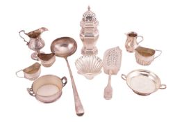 A mixed group of silver comprising a George III soup ladle, a William IV fish slice with pierced gri