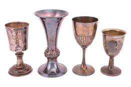 Four silver goblets of varying designs comprising a goblet with domed foot inscribed 