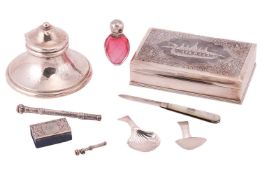 A collection of items comprising a Niello cigar box, stamped 'Sterling', a silver capstan inkwell, t