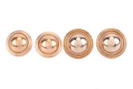 Two pairs of domed stud earrings; both of similar designs, domed circular formed with ridged borders