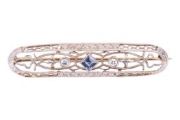 An early 20th century sapphire and diamond brooch, in an openwork design featuring a square step cut
