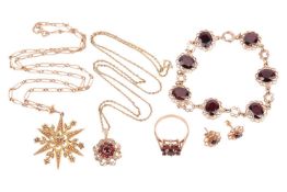 An Edwardian seed pearl star pendant and a matched suite of garnet jewellery in 9ct gold; the pendan
