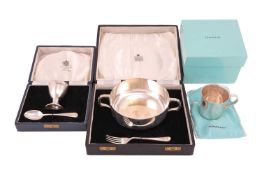 A silver twin-handled bowl by James Dixon & Sons for Garrard, Sheffield 1948, on fluted circular