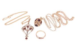 Two pendants on chain and a gem-set ring; the first containing an ovoid-shaped pendant set with five