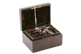 An Edwardian fitted Morocco leather jewellery box with functioning Bramah lock and key, the box cont