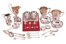 A set of six silver coffee spoons in case, a silver milk jug with matching two handled sugar bowl, a