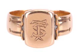 A Victorian signet ring in 15ct gold, the cushion-shaped head engraved with monogram 'TS', shoulders