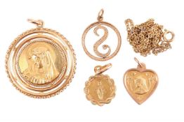 Three Virgin Mary medallions and an initial S pendant; including a circular form pendant with a chas