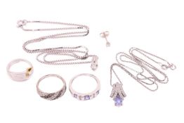 A collection of jewellery items comprising a tanzanite-set pendant and conforming ring, in white met